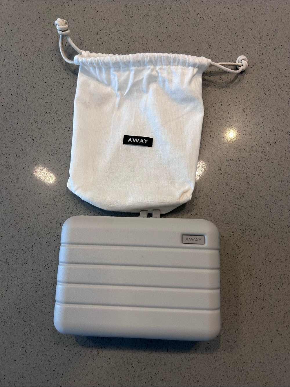 Away Mini Hard Shell Crossbody Bag in Light Gray with White Drawstring Pouch